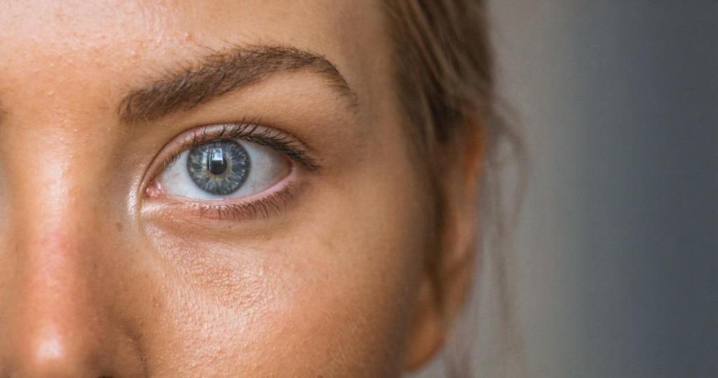 A blurry, out-of-focus close-up of an eye, lacking sharpness and detail, before AI enhancement.