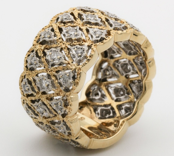 A slightly blurry gold and diamond ring product photo before AI enhancement.